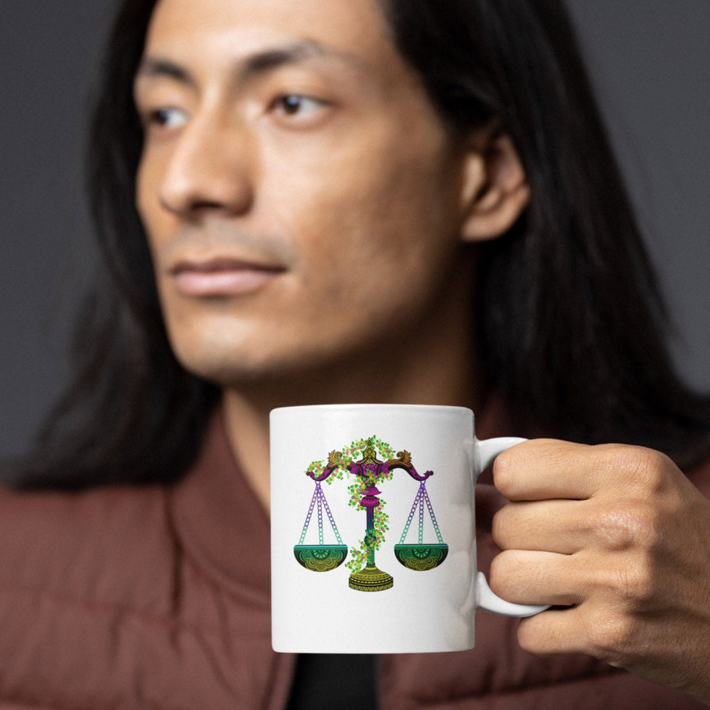 Image of Model holding Coffee Mug with Libra Sign designed by AK Pattern Studio