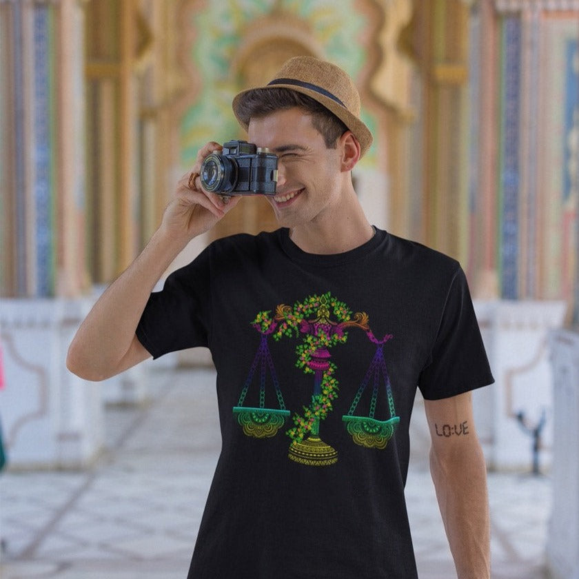 Man Wearing Black Graphic Tee with Libra Zodiac Sign Graphic by AK Pattern Studio