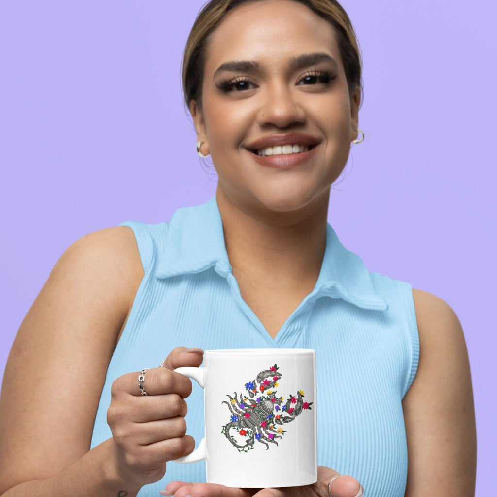 Image of Model holding Coffee Mug with Scorpio Sign designed by AK Pattern Studio
