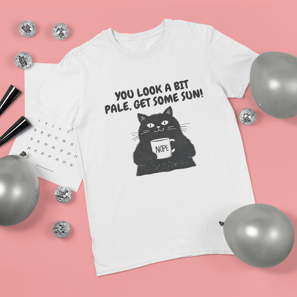 White t-shirt with a black cat graphic and text on a pink background with balloons.