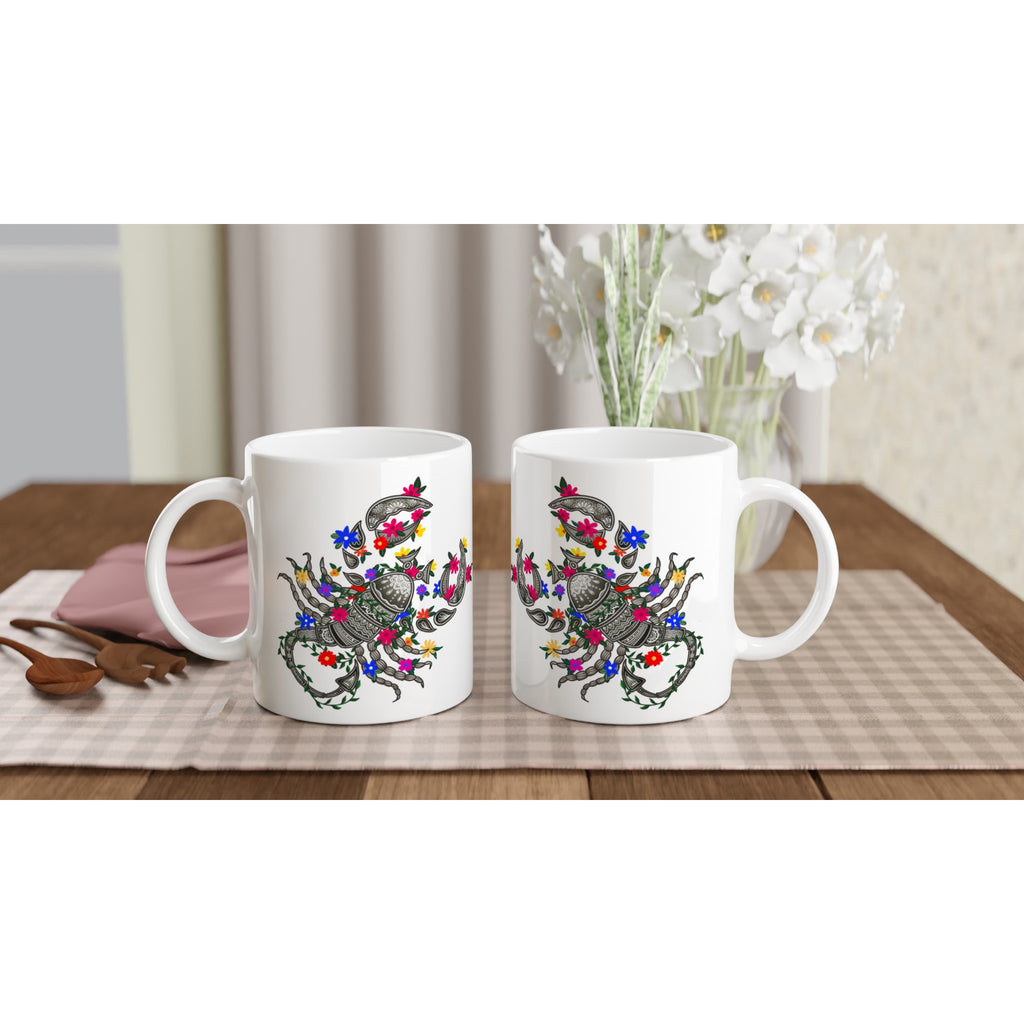 Image of two coffee white coffee mugs with Scorpio Sign designed by AK Pattern Studio 